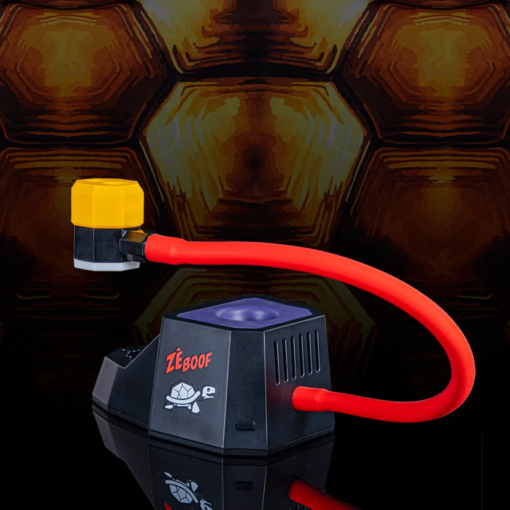 Side view of the Dab Rite x Trichome Tortoise PRO thermometer featuring red articulating arm, yellow sensor cap, and ZeBoof turtle graphic